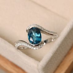 London blue topaz ring oval cut ring engagement ring | Etsy Silver Oval Aquamarine Ring, Elegant Oval Aquamarine Birthstone Ring, Oval Topaz Ring For Anniversary, Elegant Oval Blue Topaz Birthstone Ring, Oval Topaz Anniversary Ring, Fine Jewelry Oval Blue Topaz Crystal Ring, Silver Oval Topaz Crystal Ring, Sapphire Colored Topaz Oval Promise Ring, Elegant Oval Blue Topaz Rings