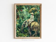 an elephant with a man sitting on it's back in the middle of a jungle