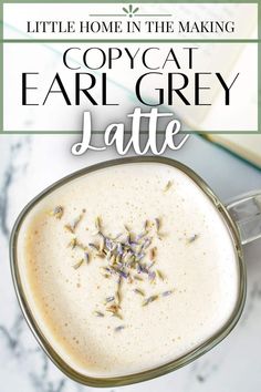 a cup of coffee with lavender sprinkles in it and the title overlay reads, little home in the making copycat ear grey latte