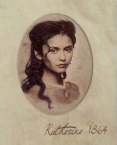 an old photo of a woman with long hair