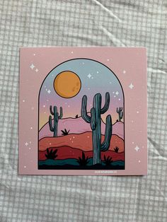 a card with an image of a cactus and the moon in the sky above it