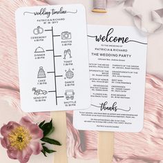 the wedding program fan is next to a pink flower