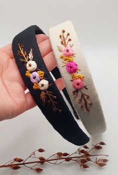 two handmade headbands with flowers on them