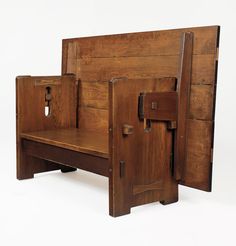 an old wooden bench with two doors open