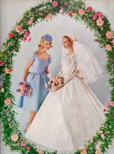 two women in wedding gowns standing next to each other with flowers on the background