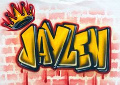 the word avan with a crown on top is spray painted in yellow and red