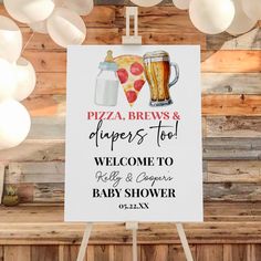 a sign that says pizza, brews and dipers too welcome to baby shower