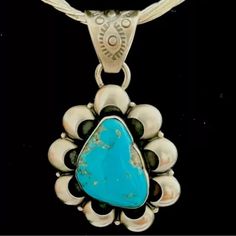 This Exquisite Pendant Is A Stunning Piece Of Native American Handmade Jewelry. Crafted From 925 Silver, It Features A Beautiful Turquoise Stone As Its Centerpiece. The Bright Blue Color Of The Stone Is Complemented By The Intricate Silverwork Around It, Making This Pendant A True Work Of Art. The Style Of The Pendant Is Traditional Yet Timeless, And It Is Sure To Be A Cherished Addition To Any Jewelry Collection. Ideal For Those Who Appreciate The Beauty And Craftsmanship Of Native American Jew Southwestern Blue Jewelry For Anniversary, Artisan Blue Turquoise Necklace With Sterling Silver Clasp, Sterling Silver Turquoise Necklace Stamped 925, Sterling Silver Turquoise Necklace With Large Pendant, Blue Turquoise Gemstone Necklace For Anniversary, Silver Turquoise Necklace Stamped 925, Blue Turquoise Necklace In Sterling Silver, Elegant Sterling Silver Turquoise Necklace, Artisan Blue Necklace Stamped 925