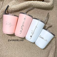 three personalized coffee mugs are sitting on a towel