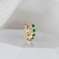 14K Solid Gold Emerald Huggie Hoop Earrings, White Gold Hoop Earrings, Yellow Gold Huggie Earrings, Gift for her, Gift for Mom. ★ Product Details: *6mm Diameter *White Gold & Yellow Gold Lovely Green Emerald Huggie Hoop Earrings *100% Handmade *100% 14K Solid Gold *Well Polished 14CT Pure Gold ★ Packaging:  Each item is packaged in our branded packaging, making your order ready to gift. Gift message is free for the all the orders. In order to have exclusive gift porch please upgrade your order. ★ Delivery Information: Order processing time is between 5-7 days as these orders personalised. For the United Kingdom, orders have been sent with Signed First Class Delivery with Royal Mail which can take 1-2 days to be delivered. For the U.S.A and rest of the world, orders have been sent with Roya Green Hoop Huggie Earring, Gold Small Hoop Earrings For May Birthstone, Green Huggie Hoop Earrings For Anniversary, Green Small Hoop Huggie Earrings For Anniversary, Gold Huggie Earrings, Silver Packaging, White Gold Hoop Earrings, Earrings White Gold, White Gold Hoops