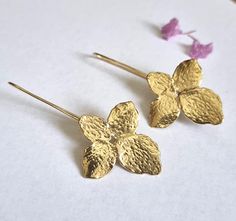 Gold large flower earrings, statement earrings, gold wedding earrings, long earrings, gold drop earrings, gold earrings gold bridal earrings Large, notable and unique handmade flower earrings made of 4 uneven petals. The statement earrings are designed as romantic soft looking flowers and are just the perfect bridal earrings. Dimensions: The flower earrings are 1.4X1.1 inches (about 3.5X2.8 cm) Total drop is 2 inches Materials: The gold drop earrings are available both in nickel free, 14k gold p Delicate Gold Petal Flower Earrings, Gold Petal Flower Earrings For Wedding, Long Earrings Gold, Gold Wedding Earrings, Statement Earrings Gold, Gold Earrings Wedding, Drop Earrings Gold, Gold Bridal Earrings, Gold Statement Earrings