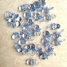 a bunch of blue and white glass beads on a table