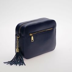 Crossbody Camera Purse - The Stratford in Dark Navy. This leather crossbody bag has classic design and style. The perfect size, it fits all your daily essentials - Phone, Coin Purse, Make Up, Keys Designed in England Full Grain Pebble Leather Yellow Gold Hardware Free Personalisation - Monogram up to four letters Free Swoon Star Keyring with every bag New Improved Wider Matching Leather Strap Matching Leather Tassel Get 20% OFF Our Bag Straps when purchased with any bag Zipped Side Pocket Two In Travel Crossbody Saddle Bag With Smooth Grain, Classic Crossbody Camera Bag For Business, Classic Smooth Grain Crossbody Bag, Classic Soft Leather Crossbody Camera Bag, Classic Crossbody Camera Bag For Travel, Travel Crossbody Bag With Smooth Grain, Smooth Grain Crossbody Bag For Travel, Classic Smooth Grain Crossbody Shoulder Bag, Smooth Grain Crossbody Travel Bag