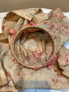 an old blouse is laying on the table