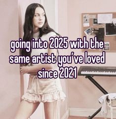 a girl standing in front of a keyboard with the words going into 205 with the same artist you've loved since 2021