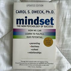 a book about mindset on a bed