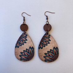 These Handmade Sunflower Wood Teardrop Boho Dangle Earrings are a beautiful combination of natural wood texture and an eye-catching sunflower design. With their lightweight, eco-friendly material, these earrings are ideal for those who appreciate bohemian, ethnic, or minimalist fashion styles. They're perfect for anyone looking for a simple, yet unique, accessory that complements both casual and more creative, free-spirited outfits. Crafted from high-quality natural wood, these earrings feature Bohemian Brown Dangle Flower Earrings, Bohemian Brown Teardrop Nickel-free Earrings, Brown Bohemian Drop Flower Earrings, Bohemian Brown Nickel-free Teardrop Earrings, Nickel-free Bohemian Brown Teardrop Earrings, Bohemian Brown Teardrop Earrings Gift, Bohemian Brown Teardrop Earrings For Gift, Bohemian Brown Flower Earrings, Bohemian Sunflower Design Flower Earrings As Gift