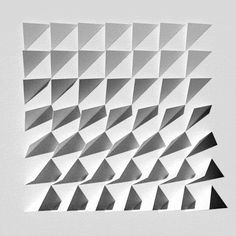 a black and white photo of an abstract geometrical design with triangles in the center