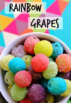 rainbow grapes in a white bowl with the words rainbow grapes on top and below it