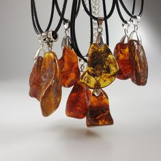 This is natural Amber Pendant, handmade of Raw Baltic Amber Gemstone. Brown or green amber Amulet, Unisex Cabochon. Tiny, not veyr big, Small Amber Pendant. Genuine Baltic amber jewelry. One Random pendant included.