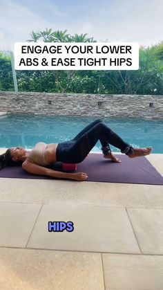 a woman laying on top of a yoga mat next to a swimming pool with the words engage your lower abs & ease tight hips