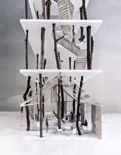 an architectural model of a house with stairs and trees