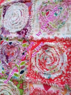 the fabric is colorful and has many different designs on it, including flowers and hearts