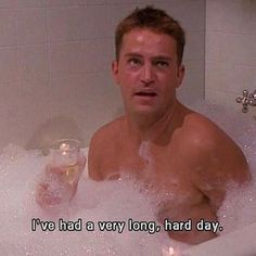 a man sitting in a bathtub full of bubbles with the caption i've had a very long, hard day