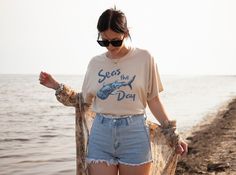 This whale shark shirt is perfect for your everyday style or your next beach day. It's an excellent daily choice! 🤩 TIP: These run true to size. If you want an oversized look size up 2-3 sizes. 😉 ✅ Shirt Information: Bella Canva 3001 Unisex Shirt - Solid colors - 100% Airlume combed and ringspun cotton - Athletic Heather - 90% Cotton/10% Polyester - Heather colors - 52% Cotton/48% Polyester - Light fabric- Soft and Stylish - Retail fit/Relaxed fit - Tear away label - Runs true to size Measurements for both imperial and metric sizes are in the photos. ✅Design Printing Design is printed using Direct to Garment (DTG) print technology. Ink is injected into the fabric leaving a very smooth print. Extremely durable. ✅ Care Instructions Due to the ink used in the design, please wash inside out Cotton T-shirt With Shark Design For Summer, Summer Short Sleeve T-shirt With Shark Design, Casual Short Sleeve Shark Design Tops, Casual Short Sleeve Top With Shark Design, Casual Summer T-shirt With Shark Design, Summer T-shirt With Shark Design, Short Sleeve, Summer T-shirt With Shark Design And Short Sleeves, Summer Short Sleeve Tops With Shark Design, Beachy Shirts