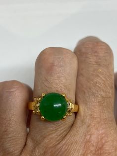 Vintage Lucky Green Nephrite Jade ring Fun jade is color enhanced Large green nephrite jade Ornate German Gold finished Vintage ring, does not tarnish, NOT sterling Size 6.5, 7 or 9 All rings are shipped free in the US in a nice gift box. Check out our over a THOUSAND great reviews Engraving is $4 per letter and is not always perfect depending on the piece. It can take a few days if the jeweler is busy. This is payable to Paypal Judithsltd@gmail.com Quartz Choker, Lucky Green, Nephrite Jade, Jade Ring, Vintage Ring, Ring Vintage, Gold Material, Cute Jewelry, Silver Bracelets