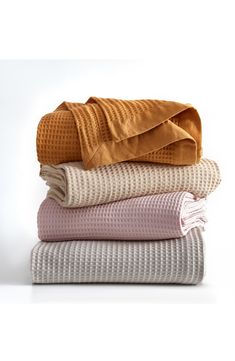 four blankets stacked on top of each other