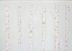 the wall is painted with white birch trees