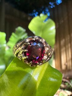 Vintage 14K yellow gold ring with large oval, 10 prong, claw set natural Garnet. Marked 14K. Birmingham hallmarks. Beautiful engraved scrollwork on the shoulders. Garnet is a deep wine red and just glows in the light. Ring size fits like ~ M1/2 or US size 6.5 due to width of band. Oval Engraved Ring With Gemstone In 14k Gold, 14k Gold Oval Engraved Ring With Gemstone, Heirloom 14k Gold Oval Ruby Ring, Heirloom Oval Ruby Ring In 14k Gold, Oval Garnet Signet Ring For Anniversary, Victorian Oval Garnet Ruby Ring, Oval Engraved Ruby Ring, Oval Engraved Ring With Center Stone In 14k Gold, Oval Ruby Ring Engraved