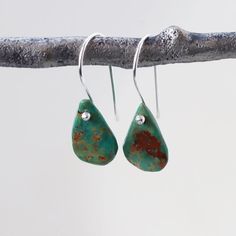 Raw natural Turquoise drops in an organic teardrop shape hang integrated onto sterling silver hook ear wires. The turquoise is full of matrix and character, and each stone is unique, making for a pair of similar but not identical gemstones — I match each pair of stones to be complimentary. The second photo shows a sample of the natural color and veining variation in each stone. The total length of the earrings is just over is approximately 1.2 inches from the curve of the earwire to the bottom o Southwestern Turquoise Teardrop Earrings For Gift, Southwestern Green Teardrop Earrings, Handmade Turquoise Teardrop Earrings, Nickel-free Turquoise Teardrop Earrings, Turquoise Teardrop Drop Earrings With Ear Wire, Bohemian Turquoise Teardrop Drop Earrings, Turquoise Bohemian Teardrop Earrings, Minimalist Turquoise Teardrop Earrings, Turquoise Teardrop Earrings