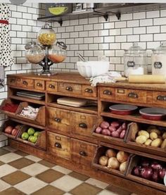 an old fashioned kitchen with lots of drawers