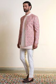 Peach bandhgala with all over mandala embroidery using vivid thread work. Paired with an inner kurta with embroidered collar, placket and straight pant. - Aza Fashions Fitted Pink Kurta For Ceremonial Occasions, Traditional Fitted Pink Bandhgala, Fitted Pink Bandhgala For Diwali, Pink Fitted Bandhgala For Diwali, Fitted Nehru Jacket For Festivals, Ceremonial Pink Fitted Traditional Wear, Festive Pink Fitted Bandhgala, Fitted Pink Bollywood Bandhgala, Festive Pink Bandhgala For Festivals