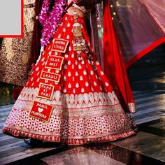 a woman in a red and white bridal gown