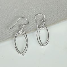 ▪︎ Sterling silver ear danglers. ▪︎ Dimensions :32.5x 9.5 mm Drop Length : 39 mm. ▪︎ These earrings are handmade with hypoallergenic 925 sterling silver ▪︎ I can send this piece in a gift box or include a gift message from you if required. ▪︎▪︎ Please read my shipping policies for shipping durations. ▪︎▪︎ Do contact me if you have any questions at nkapoor1955@gmail.com ➤ For more Pendants/Charms please visit https://www.etsy.com/shop/NeverEndingSilver?ref=seller-platform-mcnav§ion_id=24862996 ➤ Silver Linear Earrings As A Gift, Dainty Nickel Free Silver Linear Earrings, Hypoallergenic Sterling Silver Linear Earrings As Gift, Dainty Silver Teardrop Earrings As Gift, Minimalist Metal Teardrop Earrings As Gift, Nickel-free Modern Teardrop Earrings For Gift, Simple Teardrop Earrings As Gift, Simple Teardrop Earrings For Gift, Delicate Sterling Silver Linear Earrings For Gift