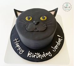 a birthday cake with a cat face on it