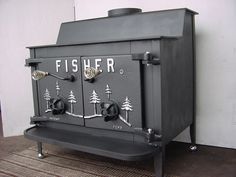 an old fashioned stove sitting on top of a rug