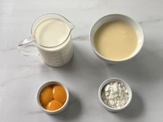 three bowls with eggs, milk and yogurt in them on a white surface