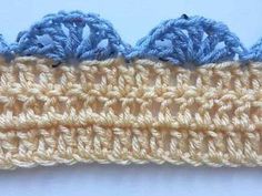 the crochet is blue and white with two rows of stitches on top of it