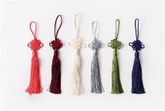 four tassels are shown in different colors