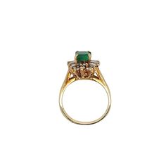 Ring Details: ✔ Gold Karat: 14K ✔ Ring Size: 7 ✔ Ring Weight: 3.9 grams ✔ Mounting: Prong ✔ Shank: Cathedral ✔ Diamonds: (6 baguette-cut diamonds, 0.24ctw) (14 round cut diamonds, 0.19ctw)  Emerald Details: ✔ Carat: 1.00 ✔ Cut: Emerald ✔ Origin: Colombia ✔ Color: Green (deep) ✔ Clarity: Very good ✔ Luster: Excellent Vintage natural Emerald and natural diamond ring in 14k solid yellow gold. This vibrant Emerald bears excellent color and luster. It's well contrasted by a round and baguette-cut dia Yellow Gold Emerald Cut Halo Ring For Formal Events, Formal Yellow Gold Emerald-cut Halo Ring, Yellow Gold Emerald Cut Halo Ring For Formal Occasions, Formal Yellow Gold Emerald Cut Halo Ring, Timeless Hallmarked Emerald Ring For Wedding, Yellow Gold Ring With Baguette Cut Halo Setting, Formal Yellow Gold Cluster Ring With Emerald, Classic Gold Marquise Emerald Ring, Classic Marquise Emerald Ring In Gold