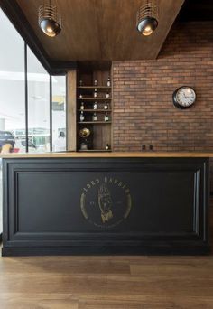 a bar with a clock on the wall behind it