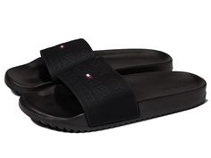 Tommy Hilfiger Roldez - Men's Shoes : Black : The Tommy Hilfiger Roldez slides offers a sleek and stylish look. Man-made upper. Man-made lining and insole. Slide-on construction. Brand logo on the strap girth. Man-made outsole. Imported. Measurements: Weight: 6 oz Product measurements were taken using size 10, width D - Medium. Please note that measurements may vary by size. Weight of footwear is based on a single item, not a pair. Classic Black Slides With Textured Footbed, Classic Slip-on Slides With Removable Insole, Classic Black Slides With Branded Insole, Classic Black Slides With Rubber Sole, Classic Open Toe Slides With Rubber Sole, Classic Black Slip-on Slides, Classic Synthetic Slides With Branded Insole, Classic Black Flat Slides, Classic Flat Slides With Removable Insole