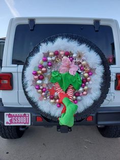 a wreath on the back of a white truck