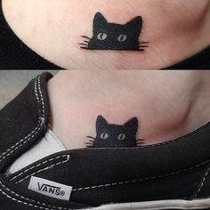 a black cat tattoo on the ankle