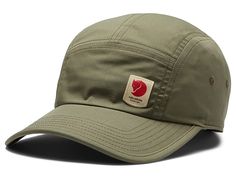 Fjallraven High Coast Lite Cap - Caps : Green : Sun protection and cool style together with Fjallraven High Coast Lite Cap. Soft sweat band inside. Reflective logo at front. Elastic stretch panel at the back. 65% polyester,35% cotton. Spot clean. Imported. Measurements: Circumference: 22 in Brim: 3 in Product measurements were taken using size SM/MD. Please note that measurements may vary by size. Breathable Cotton Baseball Cap For Outdoor Activities, Sporty Baseball Cap With Logo Patch For Outdoor Activities, Casual Windproof Baseball Cap, Sporty Baseball Cap With Logo Patch For Outdoor, Breathable Casual Baseball Cap For Camping, Casual Breathable Baseball Cap For Camping, Casual Breathable Baseball Cap For Hiking, Windproof Casual Hat For Sports, Casual Windproof Hat For Sports