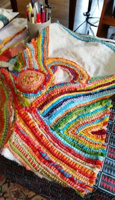 a pile of colorful fabric sitting on top of a table